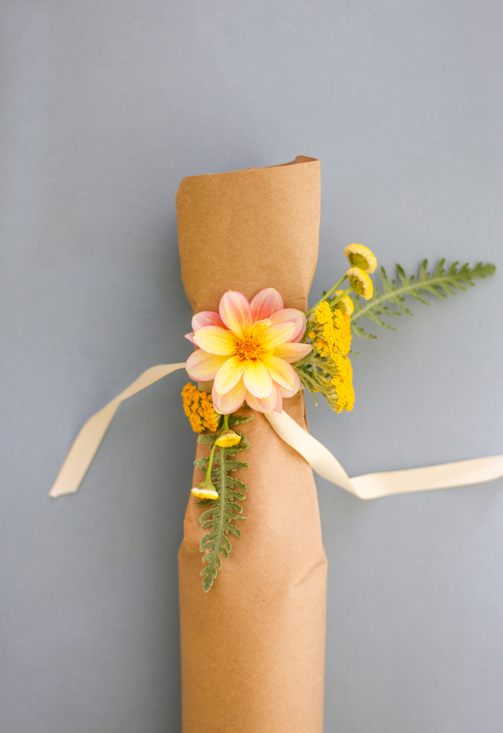 Wine wrapped in craft paper with flowers
